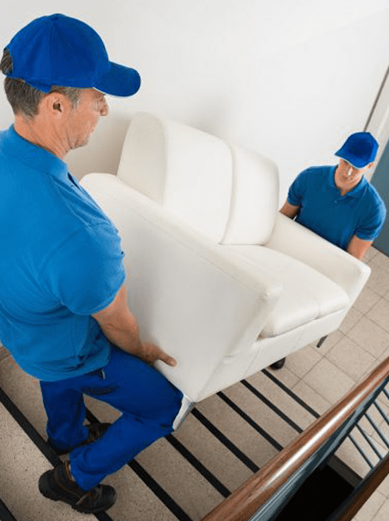burnaby movers carrying a couch downstairs